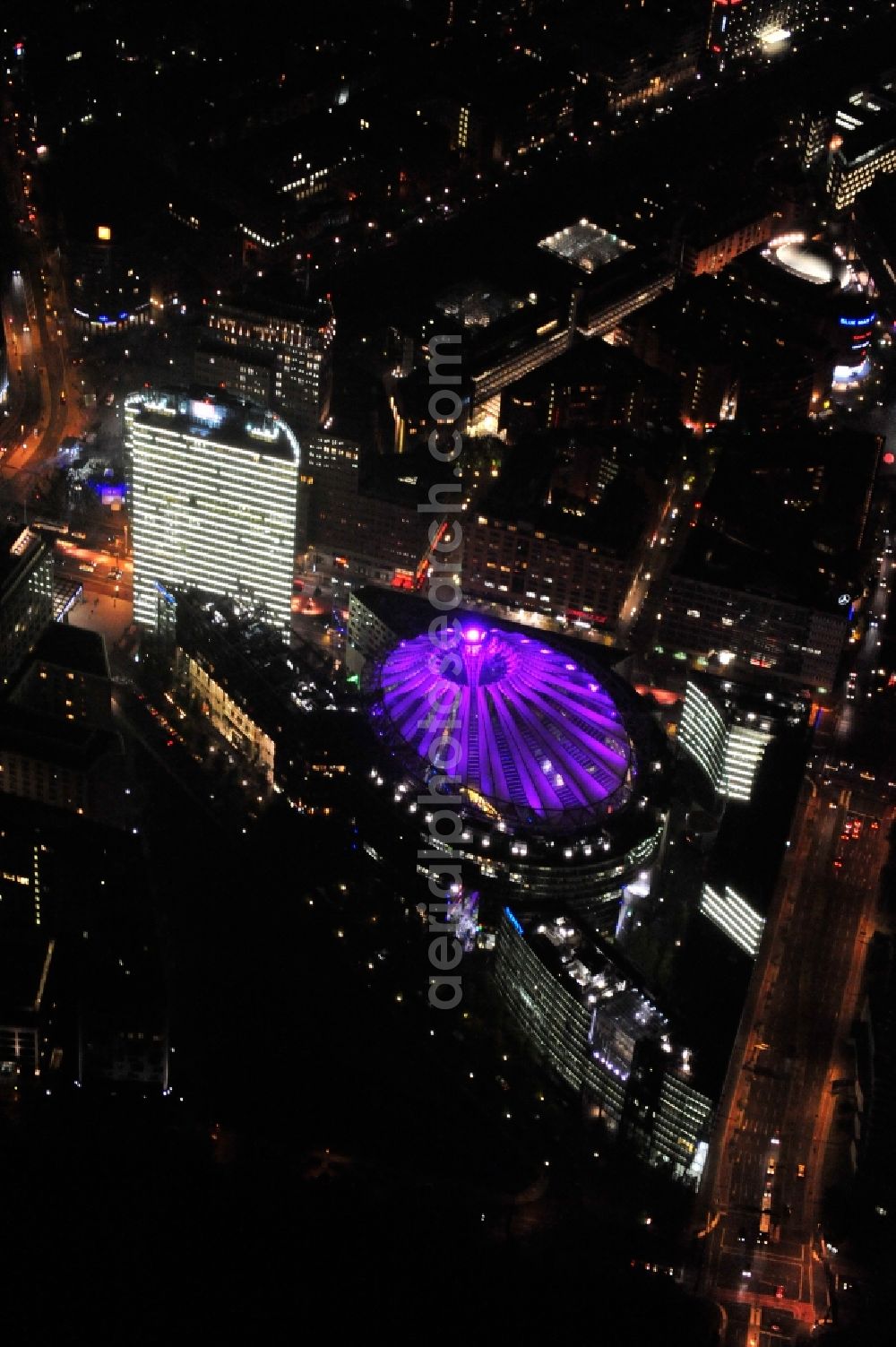 Berlin from the bird's eye view: Festival of Lights downtown of the capital Berlin. Of October 10th to 21th numerous tourist and cultural attractions of the city are enveloped in a colorful light show. To be seen in the picture is the Sony Center and the Potsdamer Platz