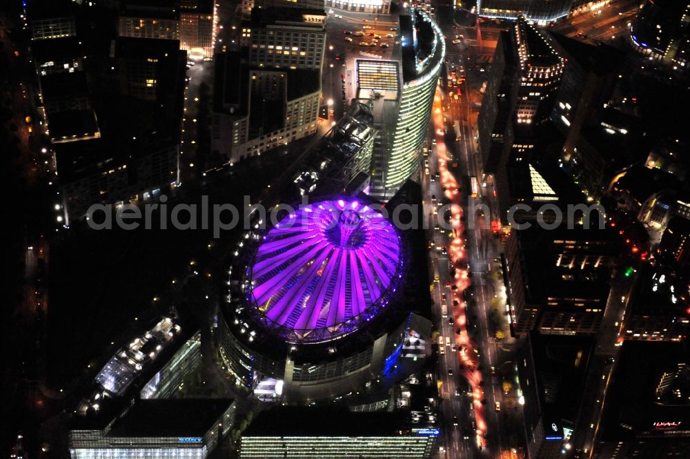 Berlin from above - Festival of Lights downtown of the capital Berlin. Of October 10th to 21th numerous tourist and cultural attractions of the city are enveloped in a colorful light show. To be seen in the picture is the Sony Center and the Potsdamer Platz