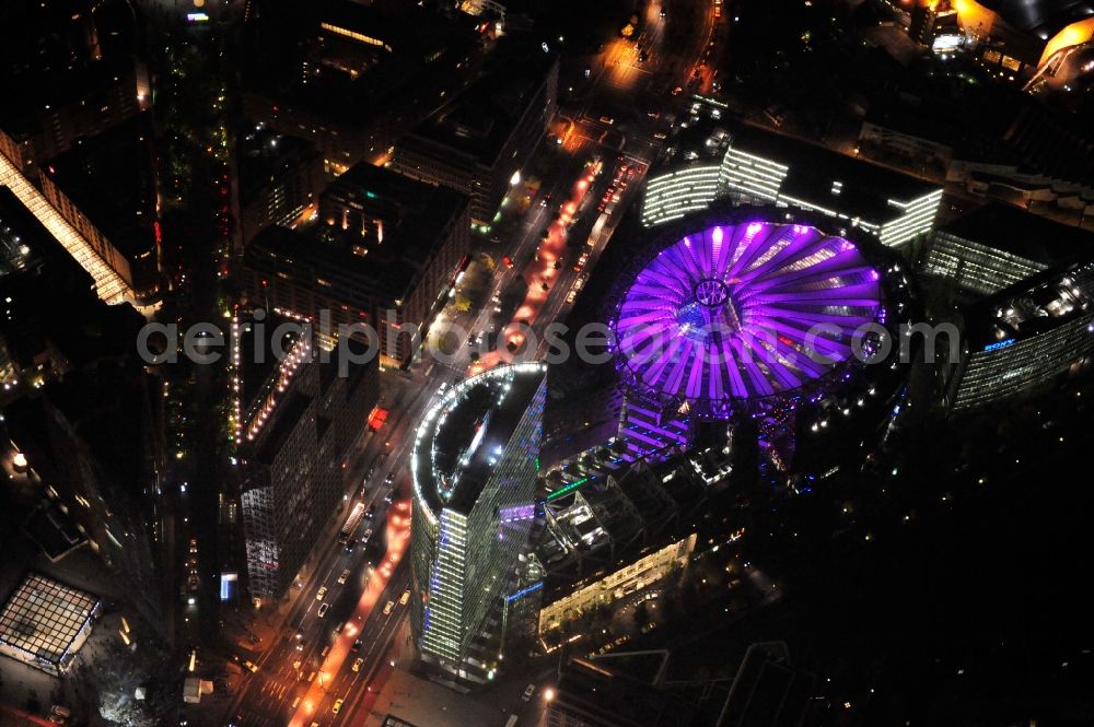 Berlin from above - Festival of Lights downtown of the capital Berlin. Of October 10th to 21th numerous tourist and cultural attractions of the city are enveloped in a colorful light show. To be seen in the picture is the Sony Center and the Potsdamer Platz