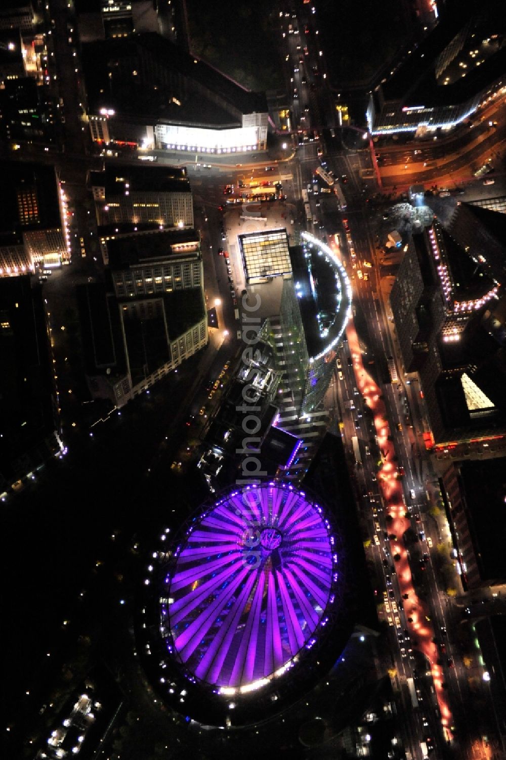 Berlin from above - Festival of Lights downtown of the capital Berlin. Of October 10th to 21th numerous tourist and cultural attractions of the city are enveloped in a colorful light show. To be seen in the picture is the Sony Center and the Potsdamer Platz