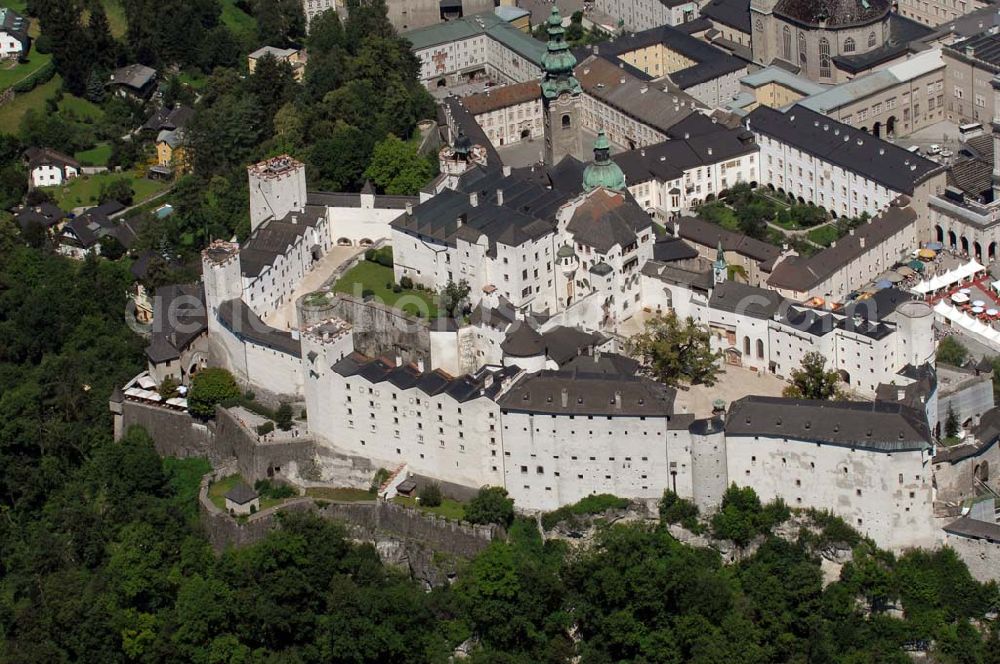 Salzburg from the bird's eye view: Die 900 Jahre alte Festung Hohensalzburg, das Wahrzeichen der Stadt, ist Europas größte und noch am besten erhaltene Burganlage. Heute gilt sie als Europas größte Festungsanlage mit mehr als 14.000 m² Baufläche. Salzburg 2007/07/14 Festung Hohensalzburg is a castle in the Austrian city of Salzburg. It sits on Festungberg hill. With a length of 250 meters and a width of 150 meters, it is one of the largest medieval castles in Europe.