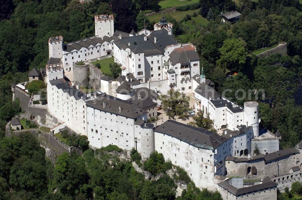 Salzburg from the bird's eye view: Die 900 Jahre alte Festung Hohensalzburg, das Wahrzeichen der Stadt, ist Europas größte und noch am besten erhaltene Burganlage. Heute gilt sie als Europas größte Festungsanlage mit mehr als 14.000 m² Baufläche. Salzburg 2007/07/14 Festung Hohensalzburg is a castle in the Austrian city of Salzburg. It sits on Festungberg hill. With a length of 250 meters and a width of 150 meters, it is one of the largest medieval castles in Europe.