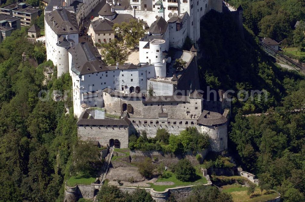 Aerial photograph Salzburg - Die 900 Jahre alte Festung Hohensalzburg, das Wahrzeichen der Stadt, ist Europas größte und noch am besten erhaltene Burganlage. Die FestungsBahn fährt Besucher in das Innere der Burg. Sie ist rechts im Bild zu erkennen. Salzburg 2007/07/14 Festung Hohensalzburg is a castle in the Austrian city of Salzburg. It sits on Festungberg hill and one of the largest medieval castles in Europe. On the ride side of the picture is the railroad, that carries visitors to the castle.