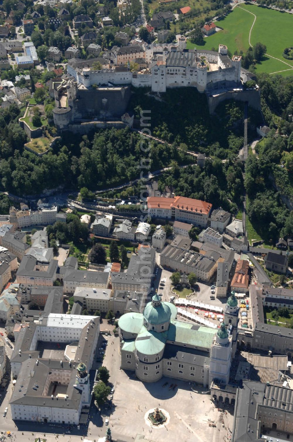 SALZBURG from the bird's eye view: Die 900 Jahre alte Festung Hohensalzburg, das Wahrzeichen der Stadt, ist Europas größte und noch am besten erhaltene Burganlage. Heute gilt sie als Europas größte Festungsanlage mit mehr als 14.000 m² Baufläche. Salzburg 2007/07/14 Festung Hohensalzburg is a castle in the Austrian city of Salzburg. It sits on Festungberg hill. With a length of 250 meters and a width of 150 meters, it is one of the largest medieval castles in Europe.