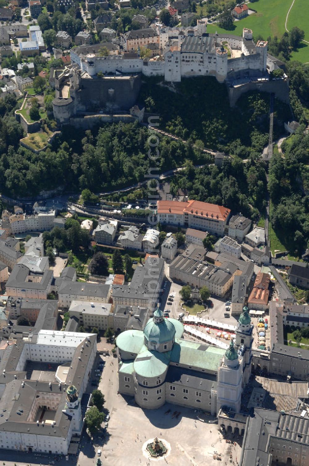 Aerial image SALZBURG - Die 900 Jahre alte Festung Hohensalzburg, das Wahrzeichen der Stadt, ist Europas größte und noch am besten erhaltene Burganlage. Heute gilt sie als Europas größte Festungsanlage mit mehr als 14.000 m² Baufläche. Salzburg 2007/07/14 Festung Hohensalzburg is a castle in the Austrian city of Salzburg. It sits on Festungberg hill. With a length of 250 meters and a width of 150 meters, it is one of the largest medieval castles in Europe.