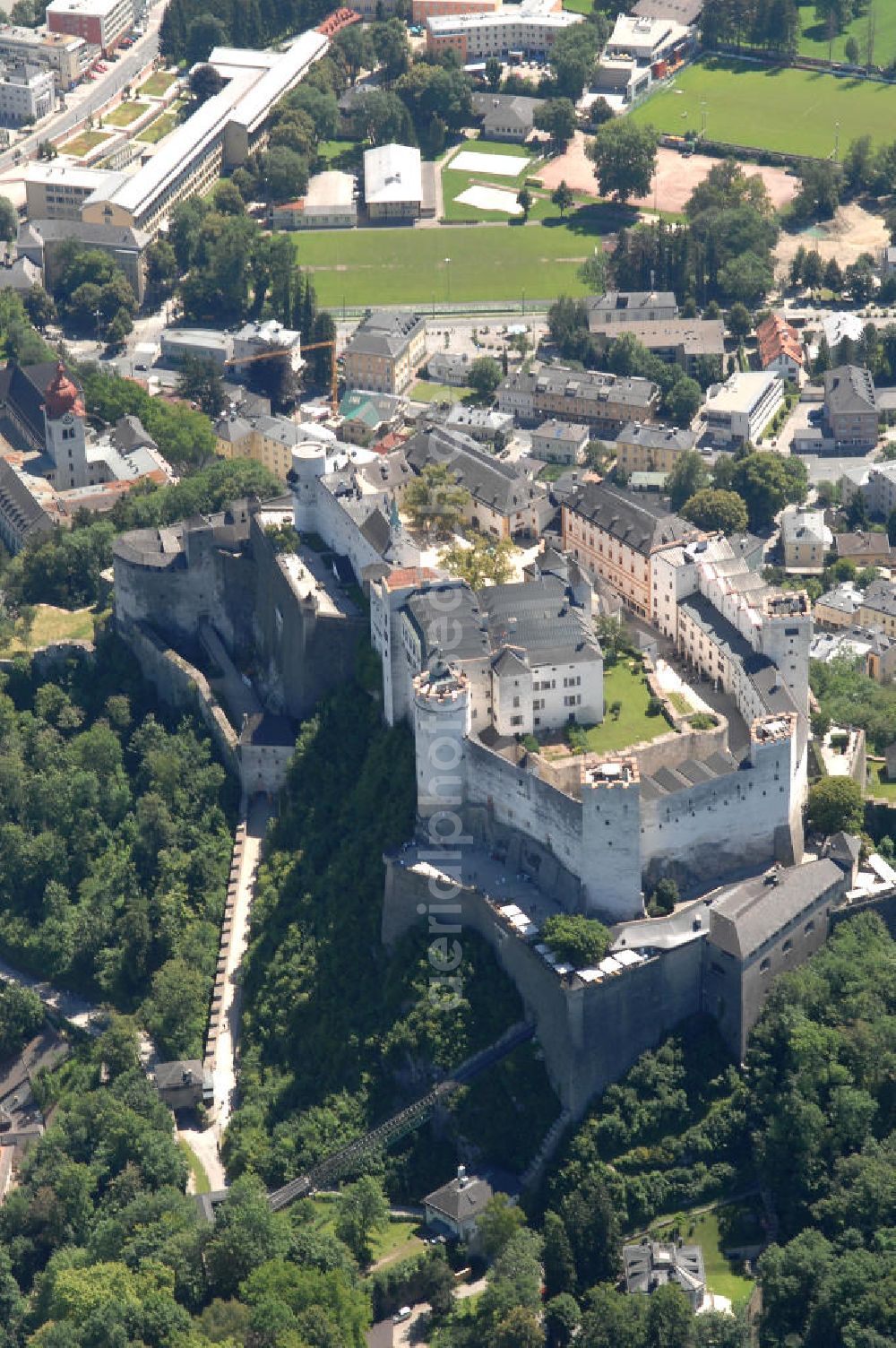 SALZBURG from the bird's eye view: Die 900 Jahre alte Festung Hohensalzburg, das Wahrzeichen der Stadt, ist Europas größte und noch am besten erhaltene Burganlage. Heute gilt sie als Europas größte Festungsanlage mit mehr als 14.000 m² Baufläche. Salzburg 2007/07/14 Festung Hohensalzburg is a castle in the Austrian city of Salzburg. It sits on Festungberg hill. With a length of 250 meters and a width of 150 meters, it is one of the largest medieval castles in Europe.