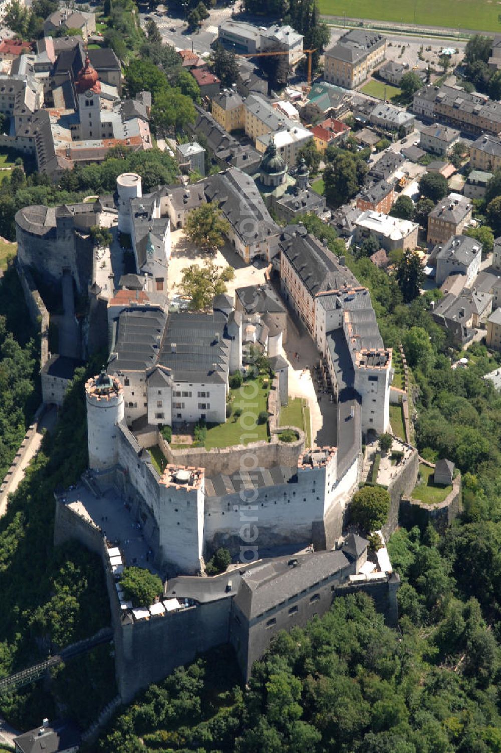 Aerial photograph SALZBURG - Die 900 Jahre alte Festung Hohensalzburg, das Wahrzeichen der Stadt, ist Europas größte und noch am besten erhaltene Burganlage. Heute gilt sie als Europas größte Festungsanlage mit mehr als 14.000 m² Baufläche. Salzburg 2007/07/14 Festung Hohensalzburg is a castle in the Austrian city of Salzburg. It sits on Festungberg hill. With a length of 250 meters and a width of 150 meters, it is one of the largest medieval castles in Europe.