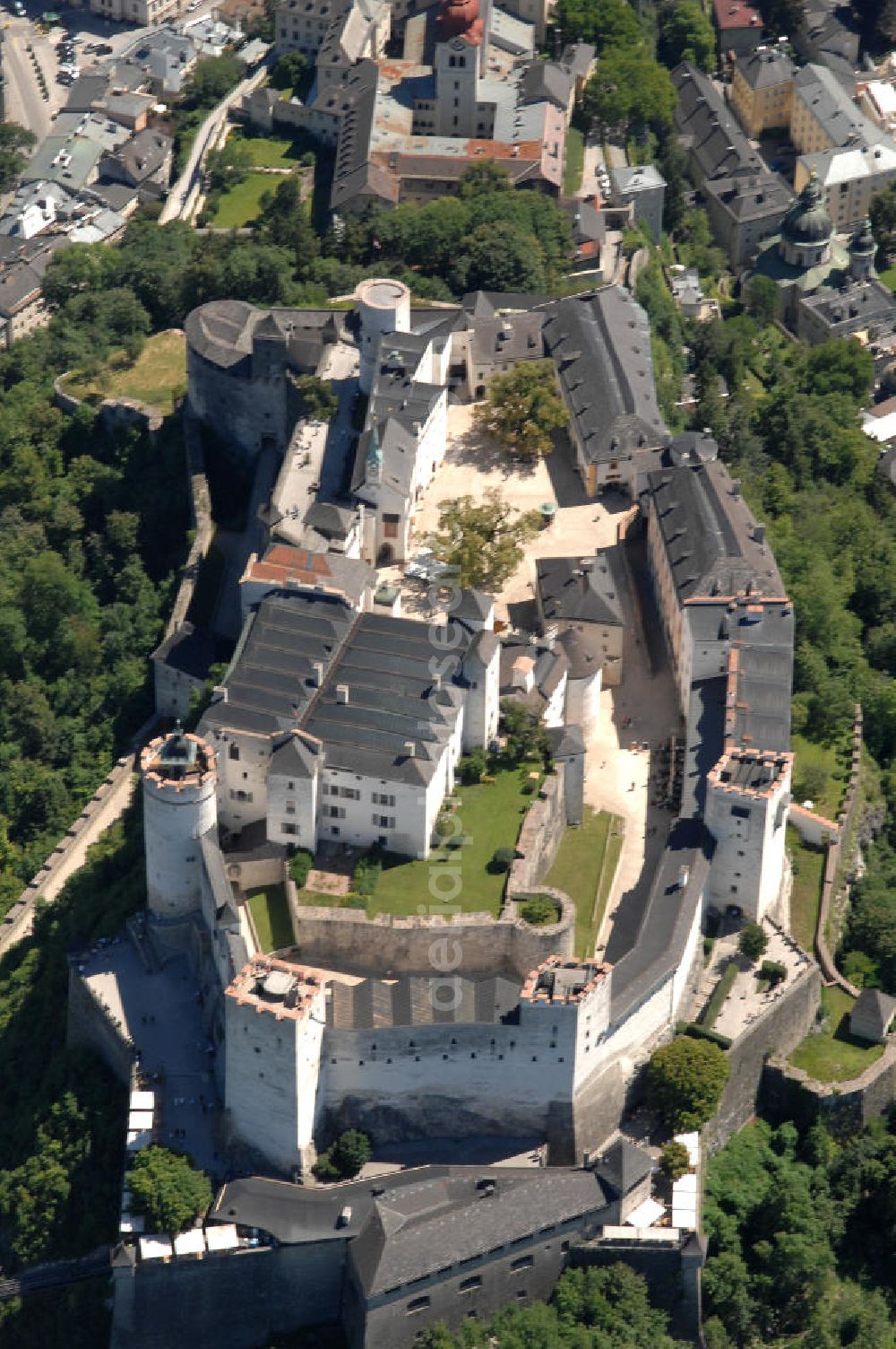 SALZBURG from the bird's eye view: Die 900 Jahre alte Festung Hohensalzburg, das Wahrzeichen der Stadt, ist Europas größte und noch am besten erhaltene Burganlage. Heute gilt sie als Europas größte Festungsanlage mit mehr als 14.000 m² Baufläche. Salzburg 2007/07/14 Festung Hohensalzburg is a castle in the Austrian city of Salzburg. It sits on Festungberg hill. With a length of 250 meters and a width of 150 meters, it is one of the largest medieval castles in Europe.