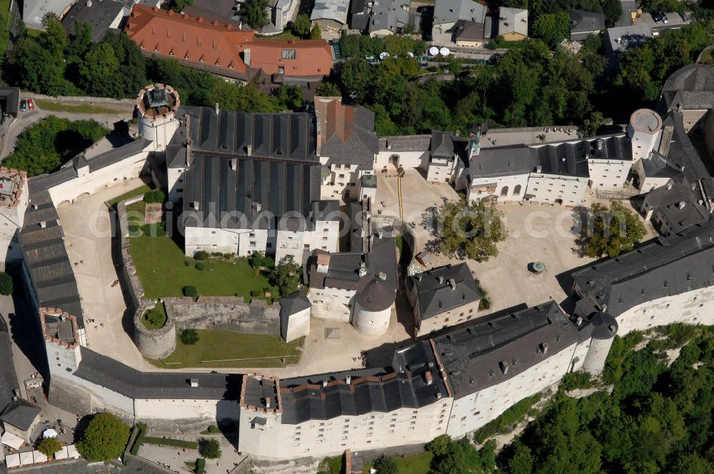 Aerial image SALZBURG - Die 900 Jahre alte Festung Hohensalzburg, das Wahrzeichen der Stadt, ist Europas größte und noch am besten erhaltene Burganlage. Heute gilt sie als Europas größte Festungsanlage mit mehr als 14.000 m² Baufläche. Salzburg 2007/07/14 Festung Hohensalzburg is a castle in the Austrian city of Salzburg. It sits on Festungberg hill. With a length of 250 meters and a width of 150 meters, it is one of the largest medieval castles in Europe.