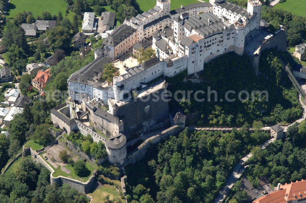 Aerial photograph SALZBURG - Die 900 Jahre alte Festung Hohensalzburg, das Wahrzeichen der Stadt, ist Europas größte und noch am besten erhaltene Burganlage. Heute gilt sie als Europas größte Festungsanlage mit mehr als 14.000 m² Baufläche. Salzburg 2007/07/14 Festung Hohensalzburg is a castle in the Austrian city of Salzburg. It sits on Festungberg hill. With a length of 250 meters and a width of 150 meters, it is one of the largest medieval castles in Europe.