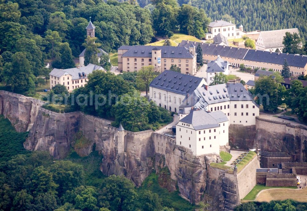 Aerial photograph Königstein - The Fortress Koenigstein at the river Elbe in the county district of Saxon Switzerland East Erzgebirge in the state of Saxony. The fortress is one of the largest mountain fortresses in Europe and is located amidst the Elbe sand stone mountains on the flat top mountain of the same name