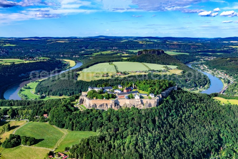 Aerial photograph Königstein - The Fortress Koenigstein at the river Elbe in the county district of Saxon Switzerland East Erzgebirge in the state of Saxony. The fortress is one of the largest mountain fortresses in Europe and is located amidst the Elbe sand stone mountains on the flat top mountain of the same name