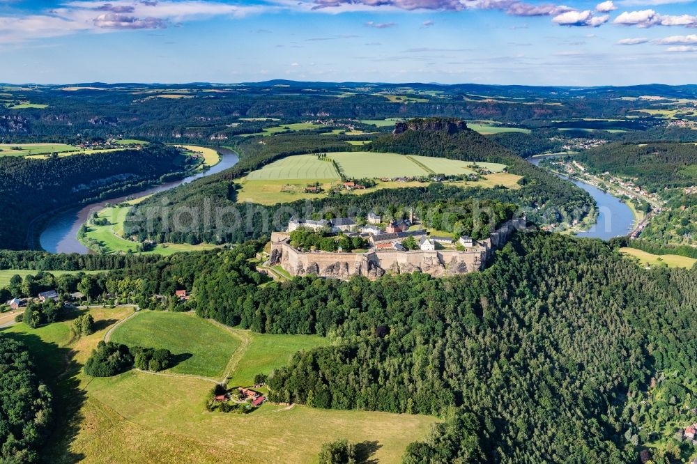 Königstein from above - The Fortress Koenigstein at the river Elbe in the county district of Saxon Switzerland East Erzgebirge in the state of Saxony. The fortress is one of the largest mountain fortresses in Europe and is located amidst the Elbe sand stone mountains on the flat top mountain of the same name