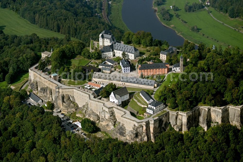 Aerial image Königstein - The Fortress Koenigstein at the river Elbe in the county district of Saxon Switzerland East Erzgebirge in the state of Saxony. The fortress is one of the largest mountain fortresses in Europe and is located amidst the Elbe sand stone mountains on the flat top mountain of the same name