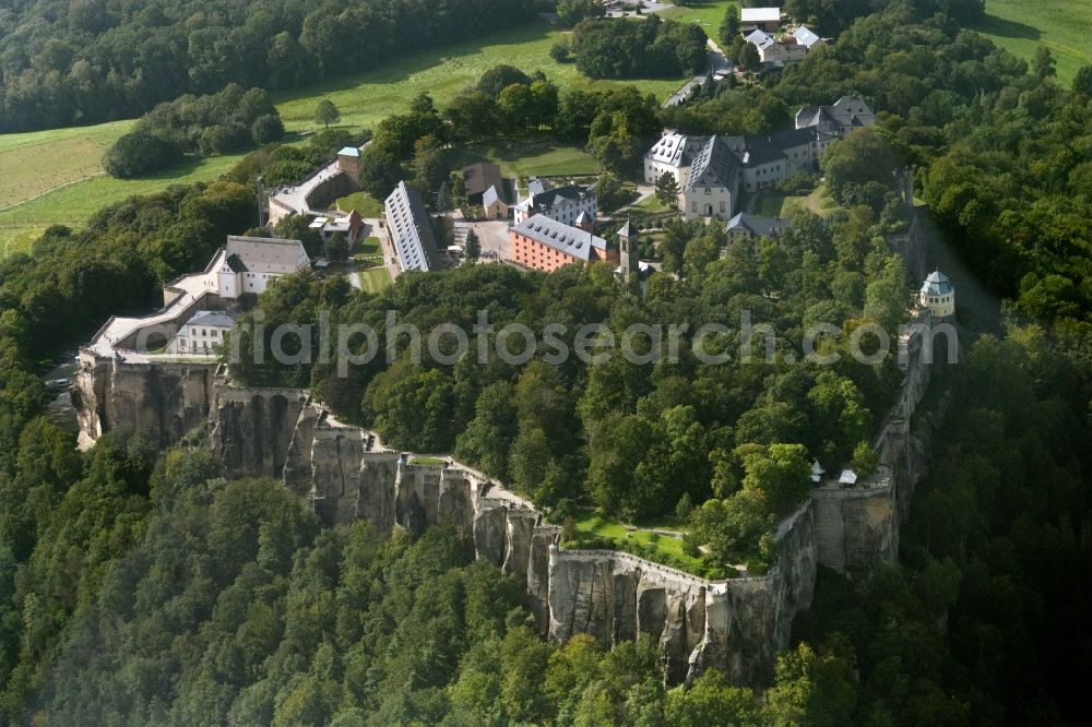 Aerial photograph Königstein - The Fortress Koenigstein at the river Elbe in the county district of Saxon Switzerland East Erzgebirge in the state of Saxony. The fortress is one of the largest mountain fortresses in Europe and is located amidst the Elbe sand stone mountains on the flat top mountain of the same name