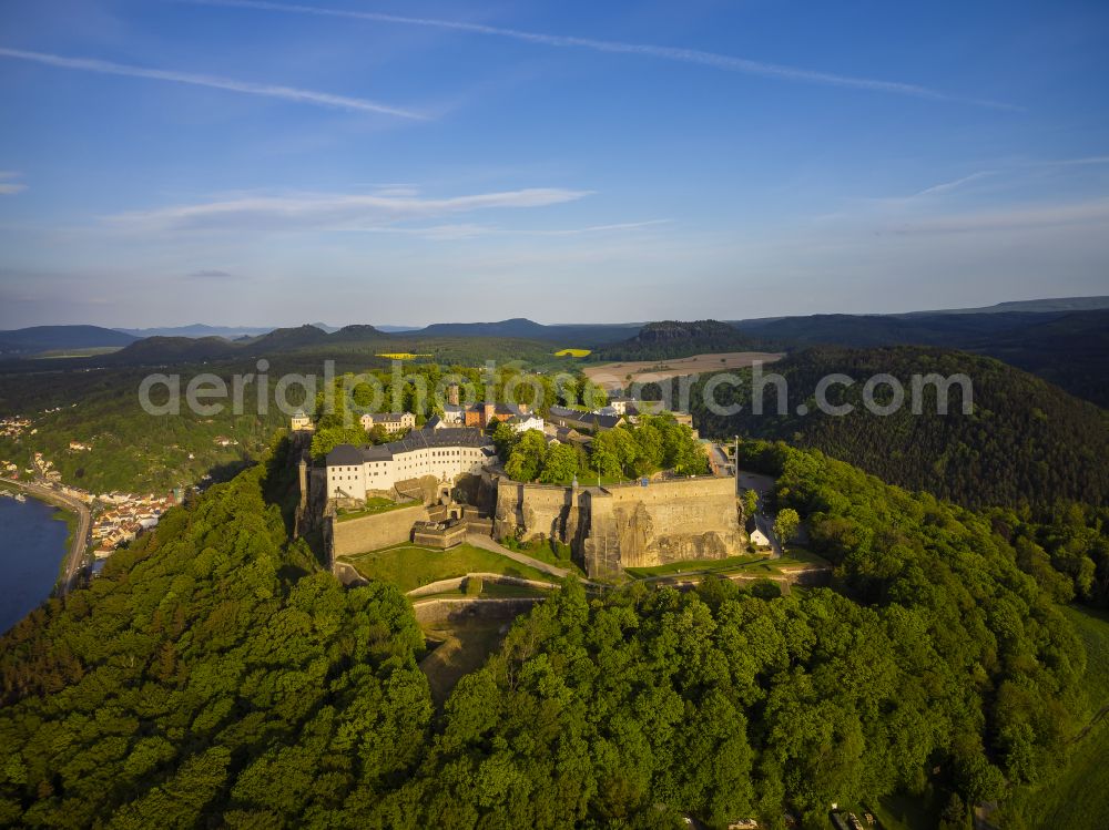 Aerial photograph Königstein - The Fortress Koenigstein at the river Elbe in the county district of Saxon Switzerland East Erzgebirge in the state of Saxony. The fortress is one of the largest mountain fortresses in Europe and is located amidst the Elbe sand stone mountains on the flat top mountain of the same name