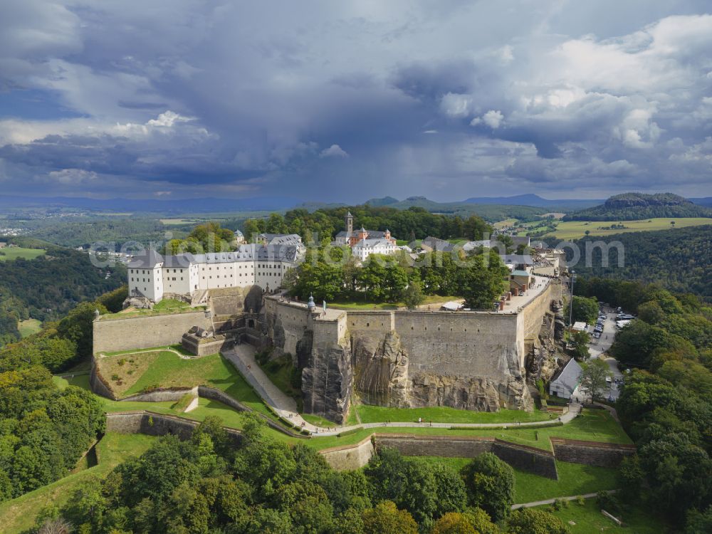 Königstein from above - The Fortress Koenigstein at the river Elbe in the county district of Saxon Switzerland East Erzgebirge in the state of Saxony. The fortress is one of the largest mountain fortresses in Europe and is located amidst the Elbe sand stone mountains on the flat top mountain of the same name