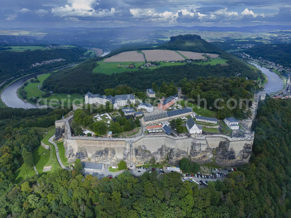 Königstein from the bird's eye view: The Fortress Koenigstein at the river Elbe in the county district of Saxon Switzerland East Erzgebirge in the state of Saxony. The fortress is one of the largest mountain fortresses in Europe and is located amidst the Elbe sand stone mountains on the flat top mountain of the same name