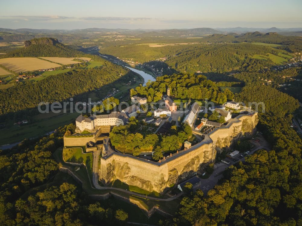 Königstein from above - The Fortress Koenigstein at the river Elbe in the county district of Saxon Switzerland East Erzgebirge in the state of Saxony. The fortress is one of the largest mountain fortresses in Europe and is located amidst the Elbe sand stone mountains on the flat top mountain of the same name