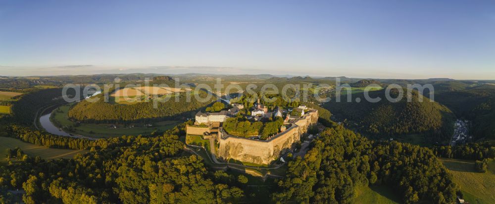 Königstein from the bird's eye view: The Fortress Koenigstein at the river Elbe in the county district of Saxon Switzerland East Erzgebirge in the state of Saxony. The fortress is one of the largest mountain fortresses in Europe and is located amidst the Elbe sand stone mountains on the flat top mountain of the same name