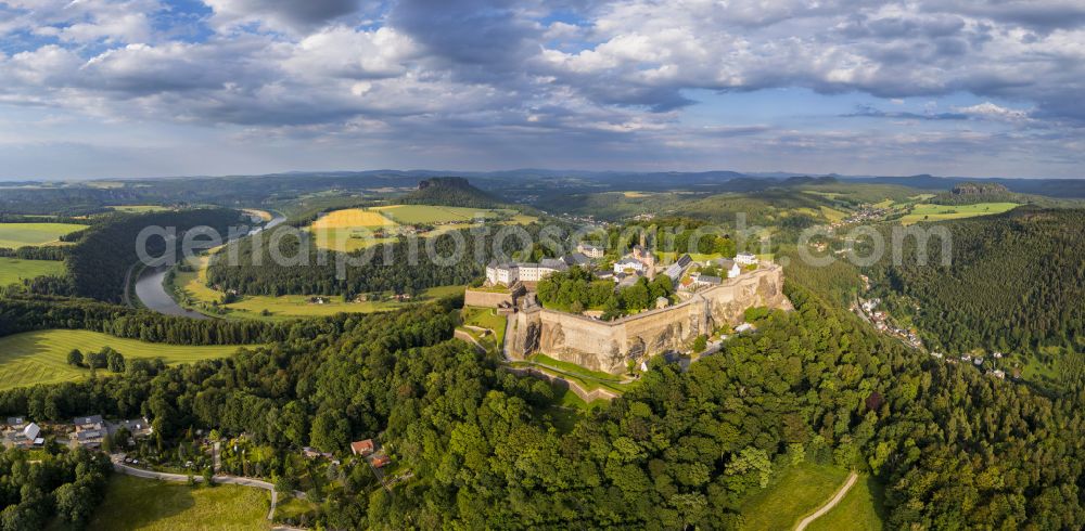 Königstein from the bird's eye view: The Fortress Koenigstein at the river Elbe in the county district of Saxon Switzerland East Erzgebirge in the state of Saxony. The fortress is one of the largest mountain fortresses in Europe and is located amidst the Elbe sand stone mountains on the flat top mountain of the same name