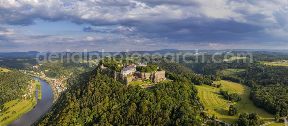 Aerial photograph Königstein - The Fortress Koenigstein at the river Elbe in the county district of Saxon Switzerland East Erzgebirge in the state of Saxony. The fortress is one of the largest mountain fortresses in Europe and is located amidst the Elbe sand stone mountains on the flat top mountain of the same name