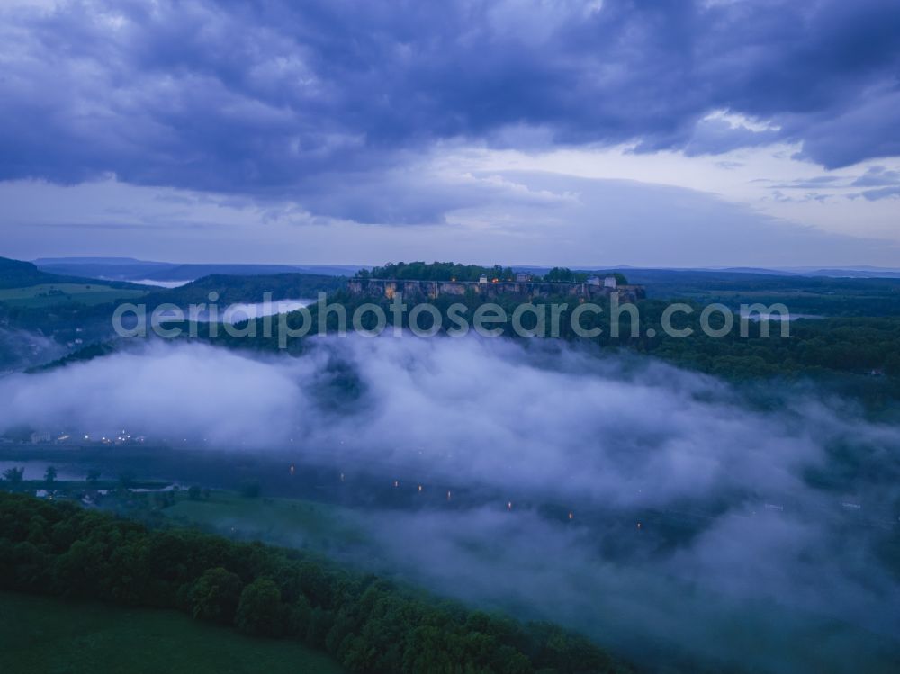 Aerial image Königstein - The Fortress Koenigstein at the river Elbe in the county district of Saxon Switzerland East Erzgebirge in the state of Saxony. The fortress is one of the largest mountain fortresses in Europe and is located amidst the Elbe sand stone mountains on the flat top mountain of the same name