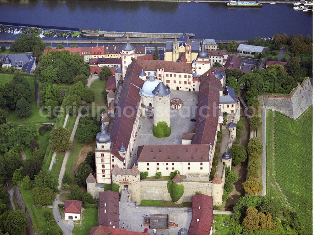 Würzburg from the bird's eye view: Blick auf die Festung Marienberg in Würzburg, Unterfranken, am Ufer des Main. Das beherrschende Wahrzeichen von Würzburg erbhebt sich auf einer Bergzunge fast 100 m über dem Main. 1990 war die Festung Teil der Landesgartenschau / Laga. 1201 wurde mit dem Bau der Festung begonnen. Heute beherbergt es das Mainfränkische Museum. Kontakt: Mainfränkisches Museum Würzburg mit Stadtgeschichtlicher Abteilung im Fürstenbaumuseum, Festung Marienberg, Oberer Burgweg, 97082 Würzburg, Tel. +49(0)931 20594-0, Fax -56, sekretariat@mainfraenkisches-museum.de