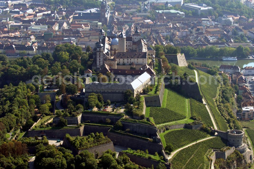 Aerial image Würzburg - Blick auf die Festung Marienberg mit Museen in Würzburg. Die Festung wurde im Laufe der Geschichte mehrfach umgebaut. Die ältesten noch erhaltenen Teile sind von 704. Bei der Bombardierung Würzburgs am 16. März 1945 wurde die Festung stark beschädigt und ab 1950 wieder aufgebaut. Heute beherbergt sie das Mainfränkische Museum Würzburg sowie das Fürstenbaumuseum. Kontakt Festung: Festung Marienberg, Nr. 239, 97082 Würzburg, Tel. +49(0)931 3551750; Kontakt Museen: Mainfränkisches Museum Würzburg, Festung Marienberg, Oberer Burgweg, 97082 Würzburg, Tel. +49(0)931 20594 0, Fax +49(0)931 20594 56, Email: sekretariat@mainfraenkisches-museum.de