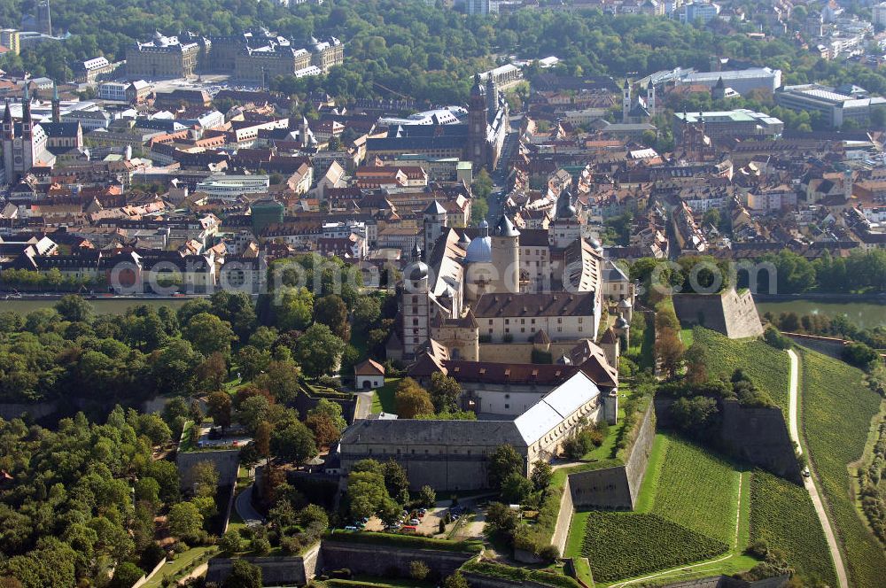 Aerial photograph Würzburg - Blick auf die Festung Marienberg mit Museen in Würzburg. Die Festung wurde im Laufe der Geschichte mehrfach umgebaut. Die ältesten noch erhaltenen Teile sind von 704. Bei der Bombardierung Würzburgs am 16. März 1945 wurde die Festung stark beschädigt und ab 1950 wieder aufgebaut. Heute beherbergt sie das Mainfränkische Museum Würzburg sowie das Fürstenbaumuseum. Kontakt Festung: Festung Marienberg, Nr. 239, 97082 Würzburg, Tel. +49(0)931 3551750; Kontakt Museen: Mainfränkisches Museum Würzburg, Festung Marienberg, Oberer Burgweg, 97082 Würzburg, Tel. +49(0)931 20594 0, Fax +49(0)931 20594 56, Email: sekretariat@mainfraenkisches-museum.de