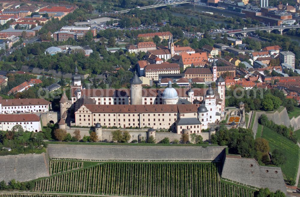 Aerial photograph Würzburg - Blick auf die Festung Marienberg mit Museen in Würzburg. Die Festung wurde im Laufe der Geschichte mehrfach umgebaut. Die ältesten noch erhaltenen Teile sind von 704. Bei der Bombardierung Würzburgs am 16. März 1945 wurde die Festung stark beschädigt und ab 1950 wieder aufgebaut. Heute beherbergt sie das Mainfränkische Museum Würzburg sowie das Fürstenbaumuseum. Kontakt Festung: Festung Marienberg, Nr. 239, 97082 Würzburg, Tel. +49(0)931 3551750; Kontakt Museen: Mainfränkisches Museum Würzburg, Festung Marienberg, Oberer Burgweg, 97082 Würzburg, Tel. +49(0)931 20594 0, Fax +49(0)931 20594 56, Email: sekretariat@mainfraenkisches-museum.de