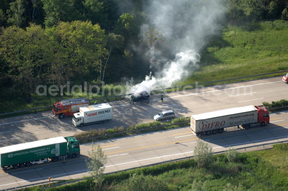 Aerial image Dessau - Blick auf einen Feuerwehreinsatz zur Löschung eines PKW- Brandes auf der Autobahn A9 / E51 bei Dessau. View of a fire department for cancellation of a car fire on the highway A9 / E51 in Dessau.