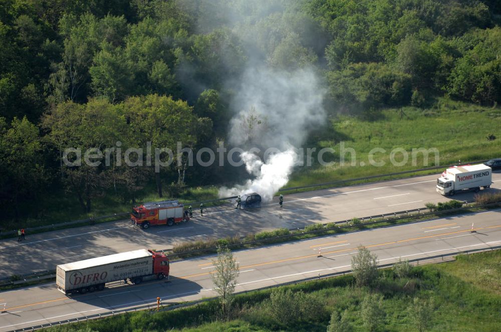 Aerial image Dessau - Blick auf einen Feuerwehreinsatz zur Löschung eines PKW- Brandes auf der Autobahn A9 / E51 bei Dessau. View of a fire department for cancellation of a car fire on the highway A9 / E51 in Dessau.