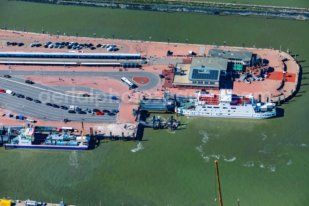Aerial photograph Norden - Ferry port facilities on the sea coast of the North Sea with the ferry Frisia 4 in the district of Norddeich in Norden in the state of Lower Saxony, Germany