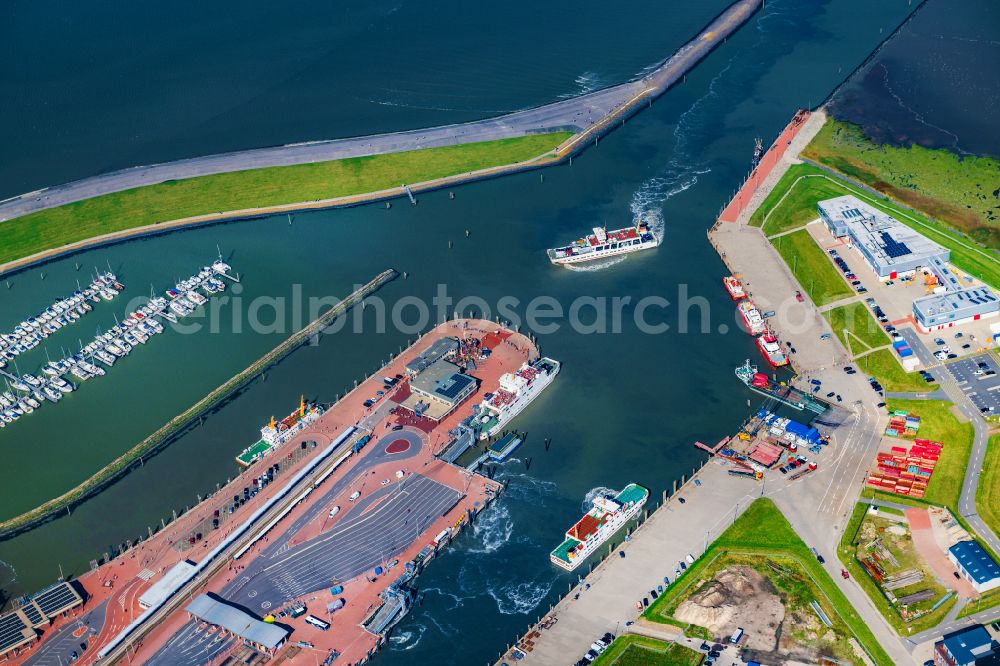 Aerial image Norden - Ferry port facilities on the sea coast of the North Sea with the ferry Frisia 4 in the district of Norddeich in Norden in the state of Lower Saxony, Germany