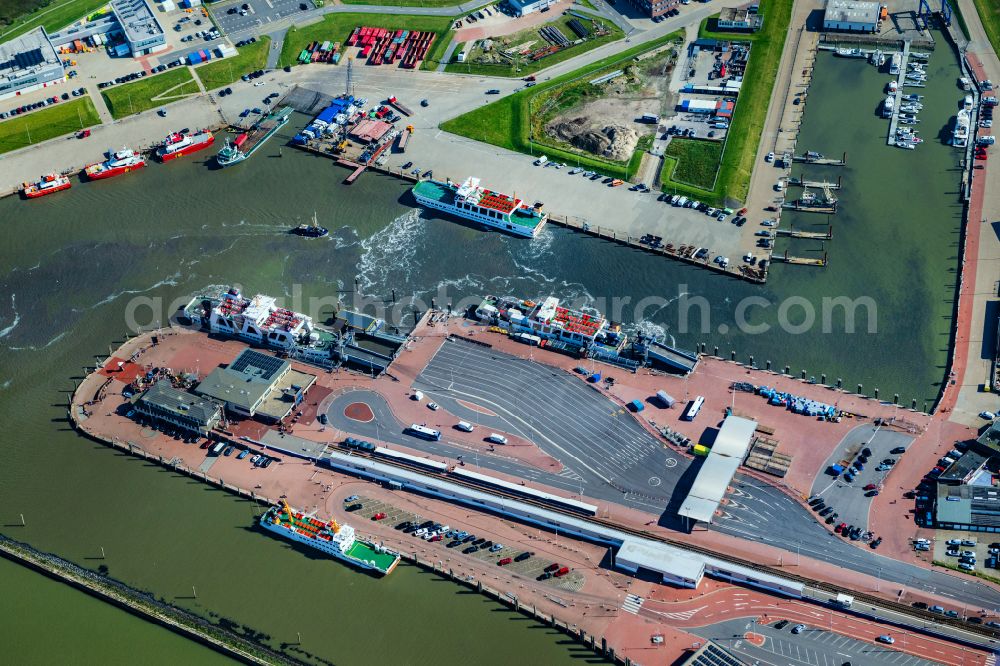 Norden from the bird's eye view: Ferry port facilities on the sea coast of the North Sea with the ferry Frisia 4 in the district of Norddeich in Norden in the state of Lower Saxony, Germany