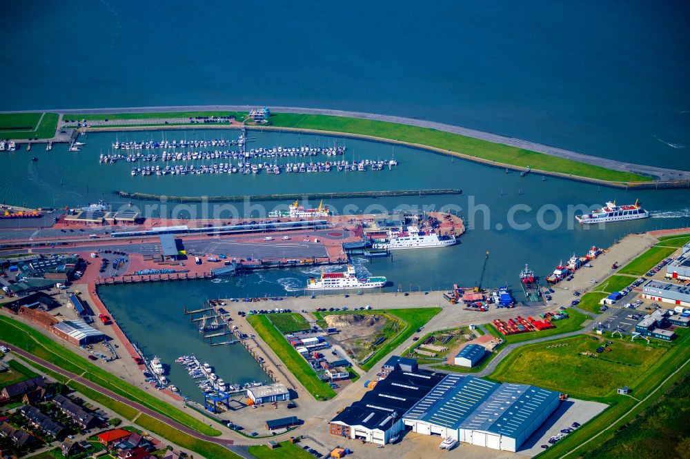 Aerial photograph Norden - Ferry port facilities on the sea coast of the North Sea with the ferry Frisia 4 in the district of Norddeich in Norden in the state of Lower Saxony, Germany