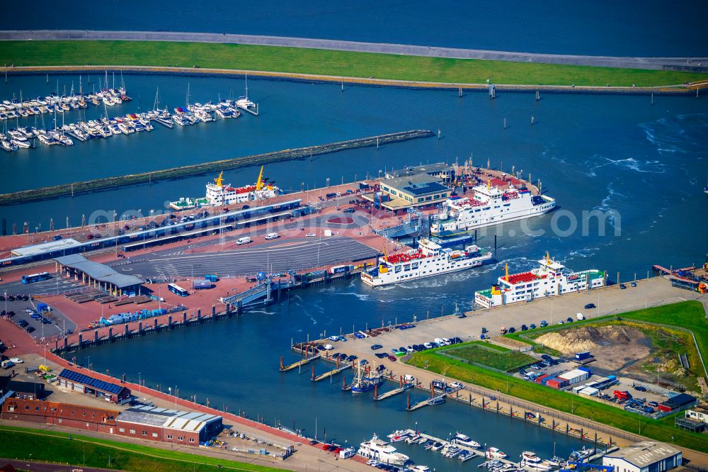 Norden from above - Ferry port facilities on the sea coast of the North Sea with the ferry Frisia 4 in the district of Norddeich in Norden in the state of Lower Saxony, Germany