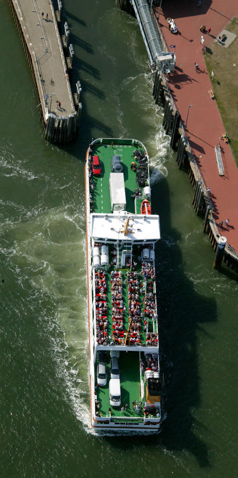 Norderney from above - Blick auf eine Fähre am Hafen von Norderney. Der Hafen Norderney dient hauptsächlich als Fährhafen und Sportboothafen. View of a ferry at the port of Norderney. The Port Norderney serves mainly as a ferry terminal and marina.