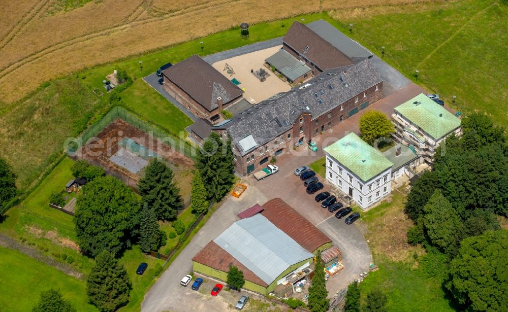 Aerial image Essen - Companies settling on an old monumental farm in Essen in North Rhine-Westphalia. Seat of Roedde Brothers - Dining furniture, the Loeschmann + Partner Consulting Engineers PartG MBB which Warns + Loeschmann engineers for structural engineering Essen GmbH, the Loeschmann + Schneider Ingenieurgesellschaft mbH for Building Technology, the Loeschmann + Partner Ingenieurgesellschaft mbH for fire protection Health and safety coordination and the Dipl.-Ing. Friedhelm Loeschmann engineer for structures State-recognized expert for the examination of stability and fire protection and Dipl.-Ing. Dipl.-Wirt-Ing. Marek Buchert Engineer for fire protection State-recognized expert for the examination of fire protection