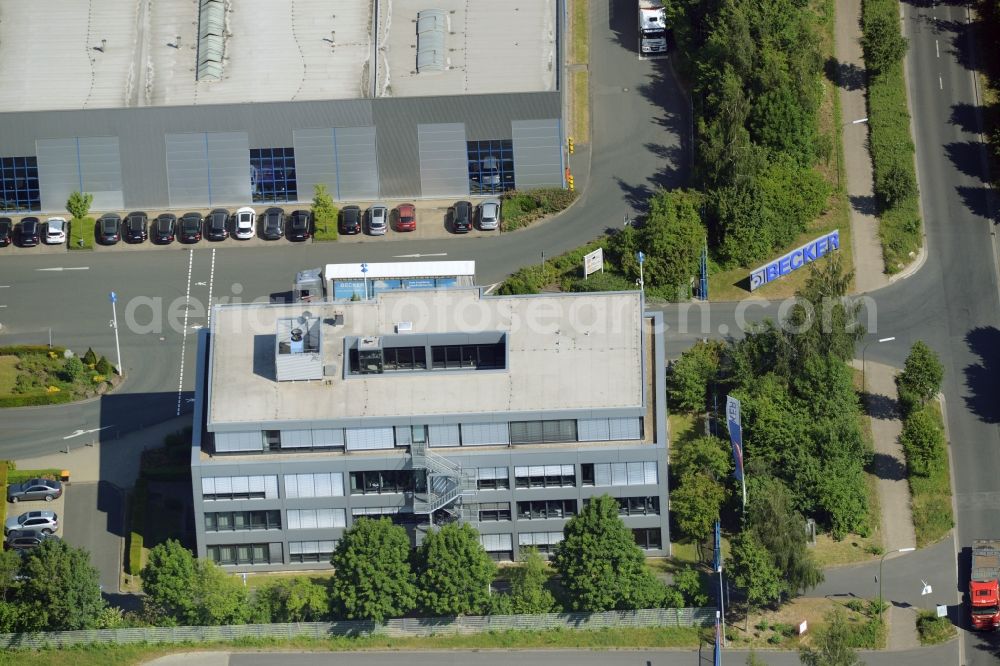 Bönen from the bird's eye view: Company compound of Becker Stahlservice GmbH&Co.KG in Boenen in the state of North Rhine-Westphalia. The steel production company includes a building complex of white halls in the industrial area in the North of Boenen