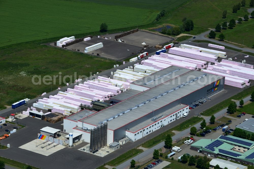 Wittenberge from the bird's eye view: Company building and production site of Austrotherm company in the Northwest of Wittenberg in the state of Brandenburg. Austrotherm produces insulating material on site in the industrial area of Wittenberg. View of the company building and material on the compound