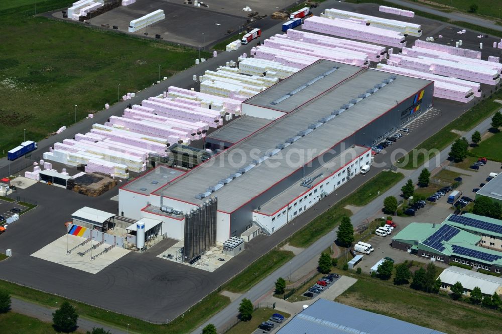 Aerial image Wittenberge - Company building and production site of Austrotherm company in the Northwest of Wittenberg in the state of Brandenburg. Austrotherm produces insulating material on site in the industrial area of Wittenberg. View of the company building and material on the compound