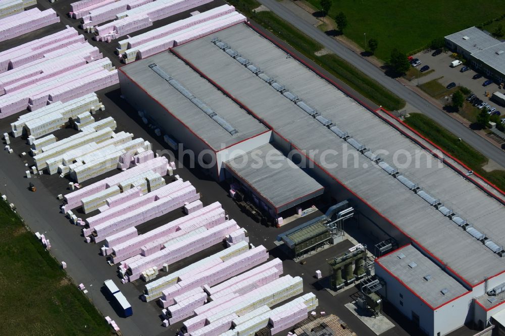 Aerial image Wittenberge - Company building and production site of Austrotherm company in the Northwest of Wittenberg in the state of Brandenburg. Austrotherm produces insulating material on site in the industrial area of Wittenberg. View of the company building and material on the compound