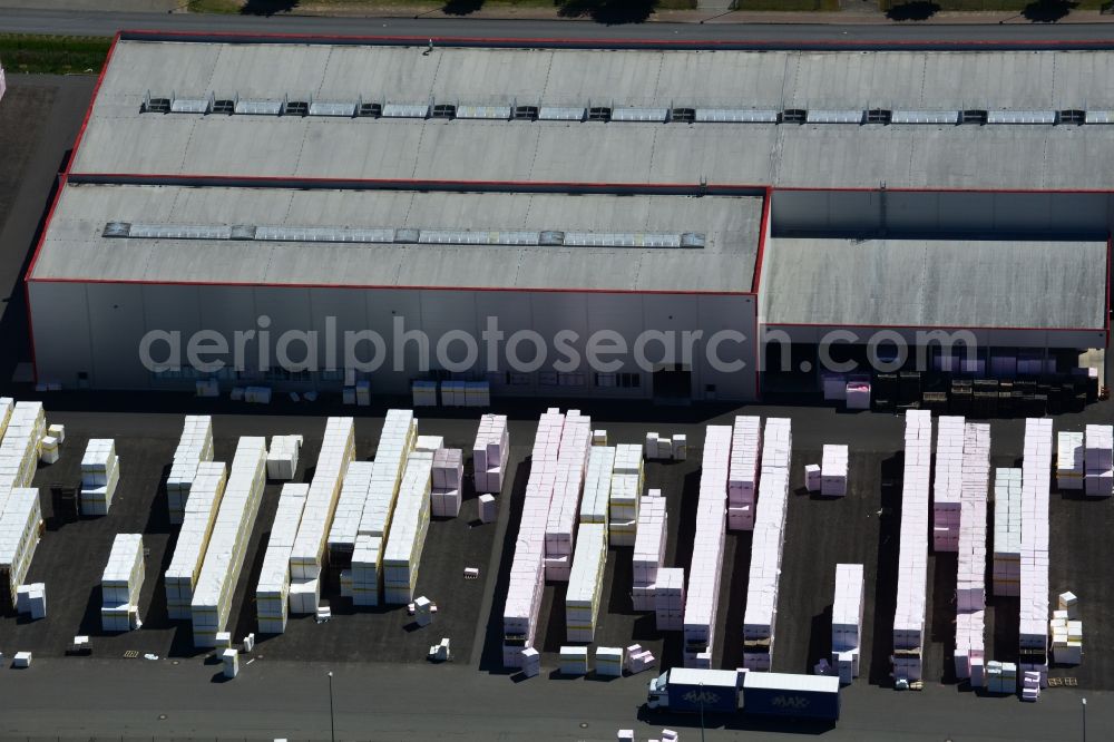 Aerial image Wittenberge - Company building and production site of Austrotherm company in the Northwest of Wittenberg in the state of Brandenburg. Austrotherm produces insulating material on site in the industrial area of Wittenberg. View of the company building and material on the compound