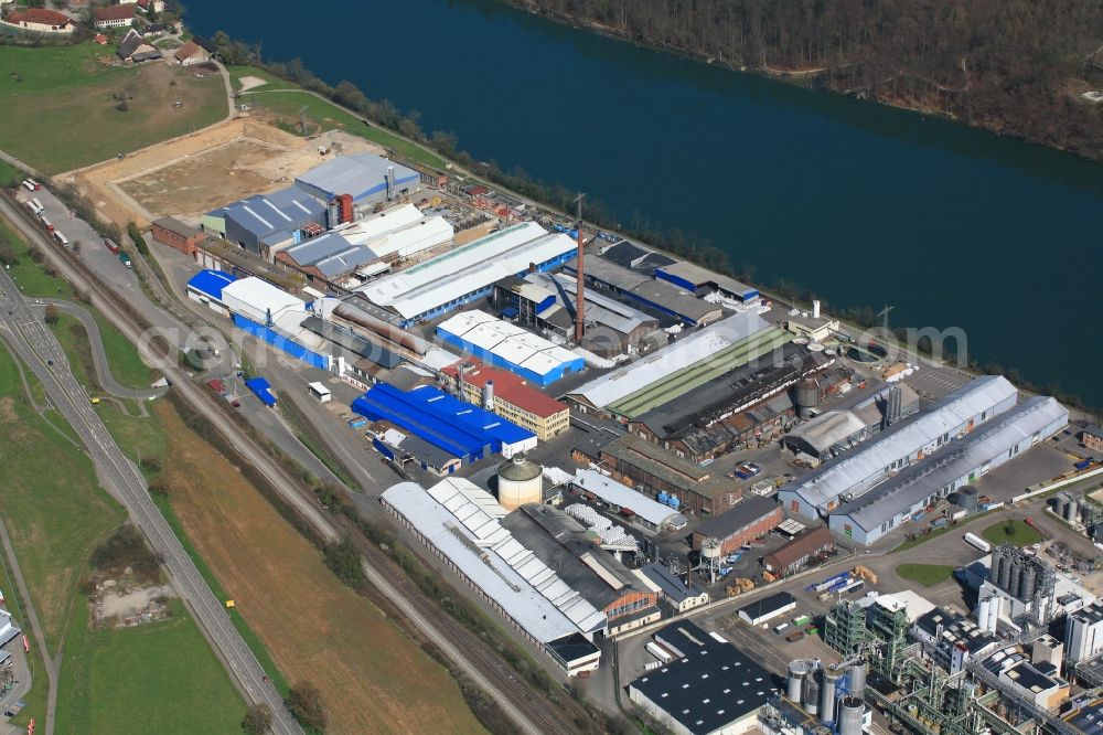 Aerial image Rheinfelden (Baden) - Company grounds and facilities of Rheinfelden Alloys GmbH & Co. KG at the Rhine river in Rheinfelden (Baden) in the state Baden-Wuerttemberg, Germany