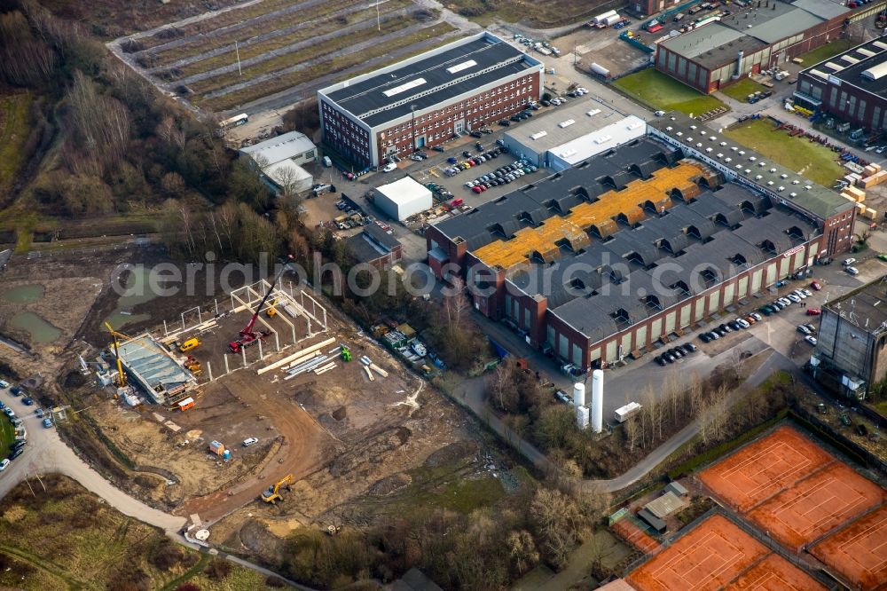 Aerial photograph Witten - Sports grounds, company grounds and industrial and commercial area on Stockumer Strasse in Witten in the state of North Rhine-Westphalia. The sports grounds are located adjacent to a construction site on Salinger Feld and the hardening plant of Haerterei VTN GmbH