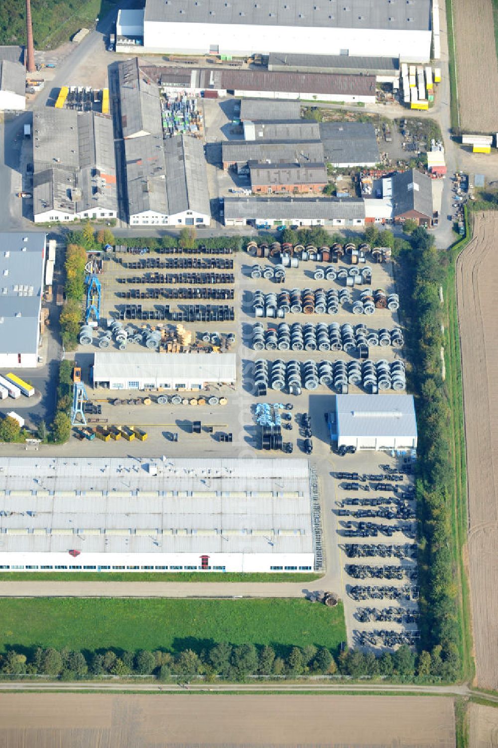 Wunstorf from above - Blick auf das Firmengelände der Firma BRUGG Rohrsysteme GmbH an der Adolf Oesterheld Str. 31 in 32515 Wunstorf. Das Unternehmen ist Spezialanbieter für Rohrsysteme zum Transport von Flüssigkeiten , Gasen und Wärme. Premises of the company in Brugg Pipe Systems Inc. in Wunstorf / Lower Saxony - Germany.