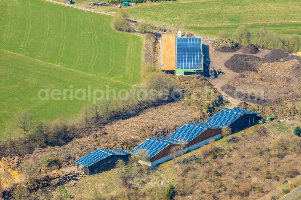 Eslohe (Sauerland) from above - Company grounds and facilities of Firma Holzenergie Schulte Fecks mit Solardaechern Am Sonneneck in Eslohe (Sauerland) in the state North Rhine-Westphalia, Germany