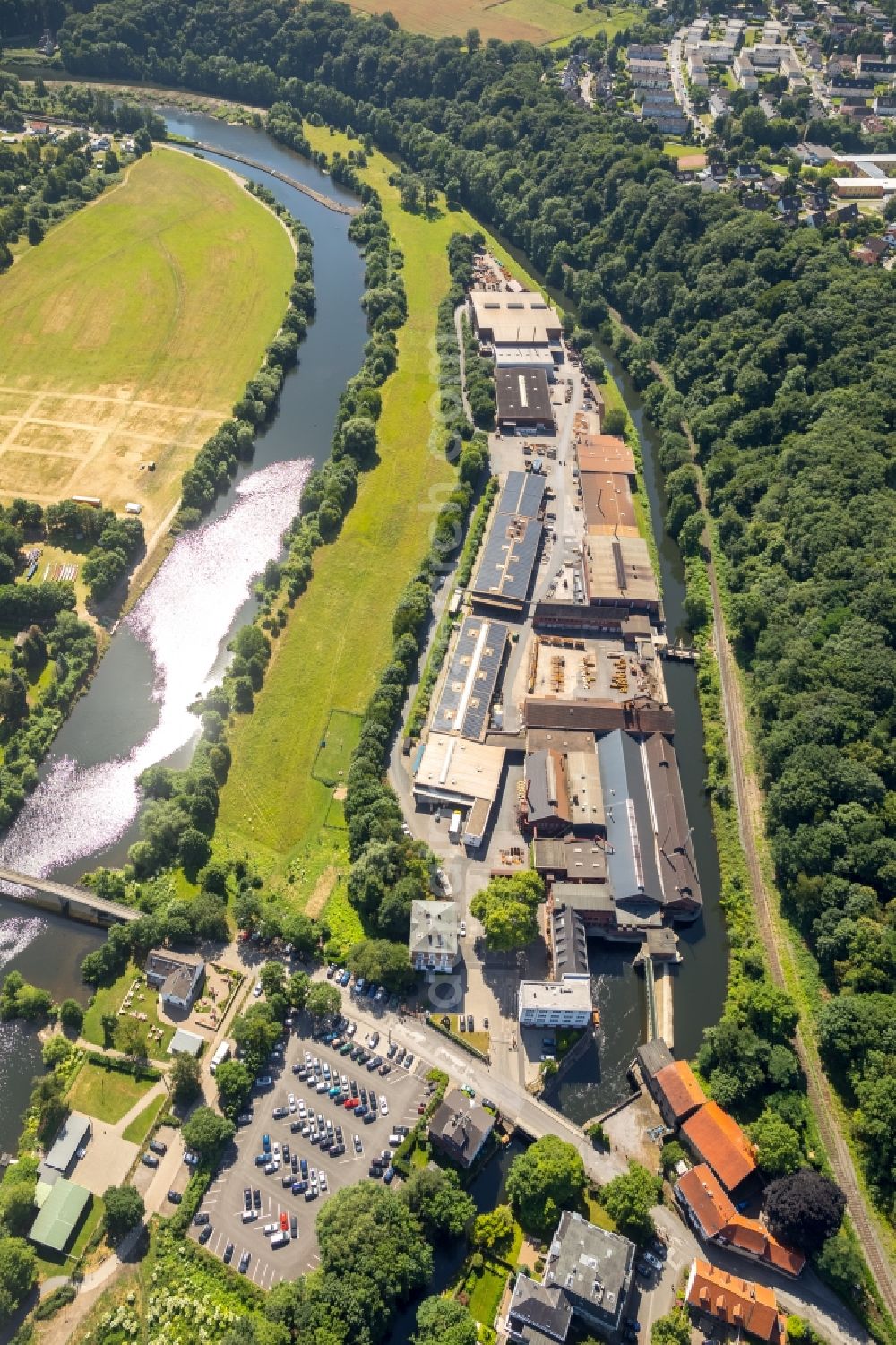 Witten from the bird's eye view: Company grounds and facilities of Friedr. Lohmann GmbH Works for steel in Witten in the state of North Rhine-Westphalia. The works are located on the riverbank of the river Ruhr